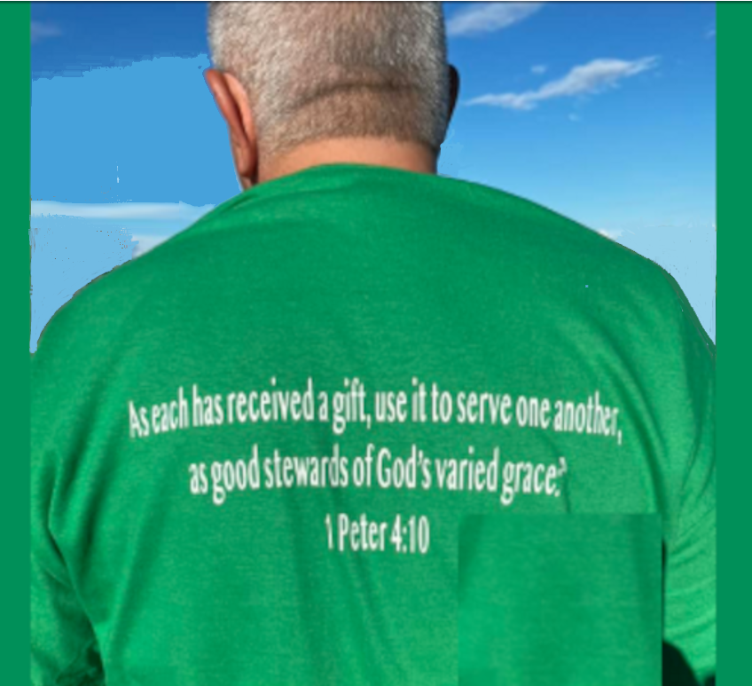 guy wearing a green t-shirt with a passage from peter 4:10